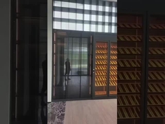 Gabinete de vino de acero inoxidable de pared completa con almacenamiento y asientos en negro elegante