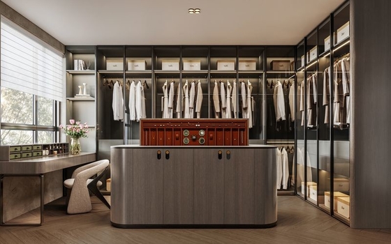Custom Stainless Steel Walk-In Closet With Electric Lift Island And Ample Storage